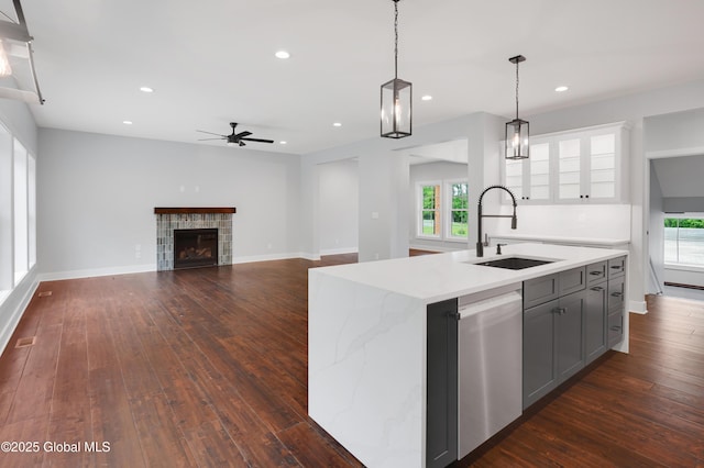 722 Swaggertown Rd, Glenville, NY 12302 - kitchen with a sink, stainless steel dishwasher, a ceiling fan, gray cabinets, and healthy amount of natural light