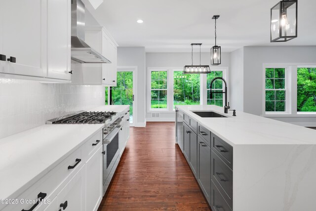 722 Swaggertown Rd, Glenville, NY 12302 - kitchen featuring wall chimney range hood, a sink, high end stainless steel range, dark wood-type flooring, and decorative backsplash