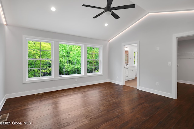 722 Swaggertown Rd, Glenville, NY 12302 - unfurnished bedroom with a walk in closet, lofted ceiling, wood-type flooring, baseboards, and a closet
