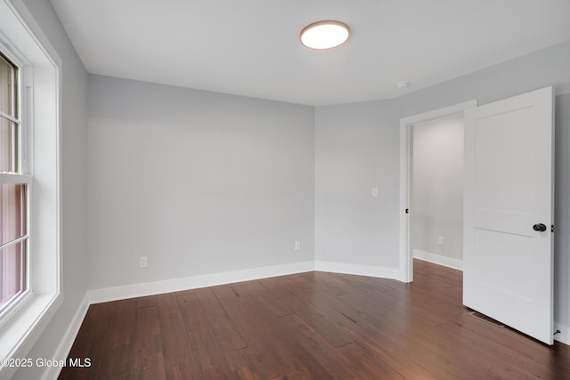 722 Swaggertown Rd, Glenville, NY 12302 - empty room featuring wood-type flooring, baseboards, and a smoke detector