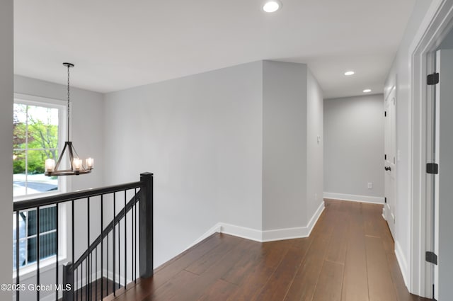 722 Swaggertown Rd, Glenville, NY 12302 - hall featuring a chandelier, an upstairs landing, dark wood-style flooring, recessed lighting, and baseboards