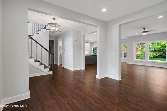 722 Swaggertown Rd, Glenville, NY 12302 - foyer entrance with dark wood-style floors, stairs, healthy amount of natural light, a chandelier, and recessed lighting
