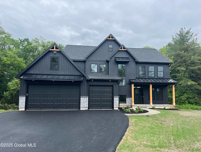 722 Swaggertown Rd, Glenville, NY 12302 - modern farmhouse with a standing seam roof, roof with shingles, asphalt driveway, and an attached garage