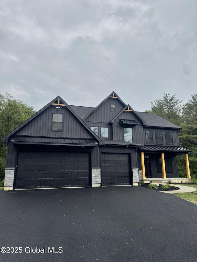 722 Swaggertown Rd, Glenville, NY 12302 - view of front of home with a standing seam roof, board and batten siding, driveway, and metal roof