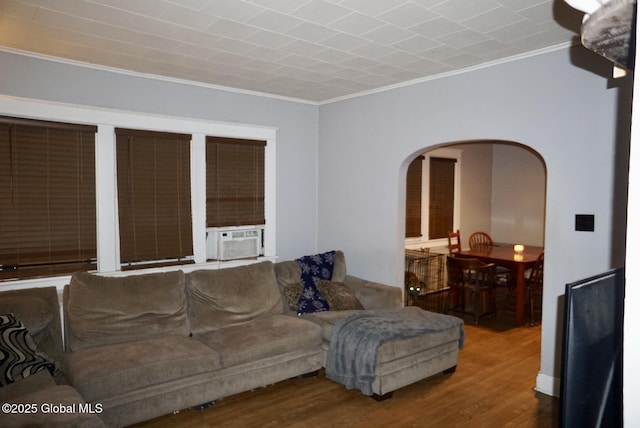 living room with ornamental molding, hardwood / wood-style floors, and cooling unit