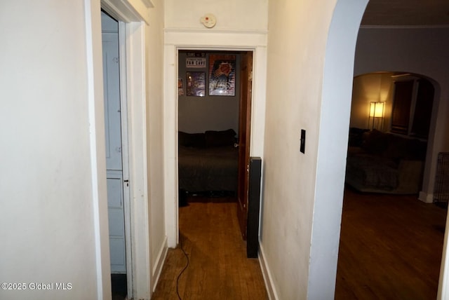 hallway featuring dark hardwood / wood-style floors