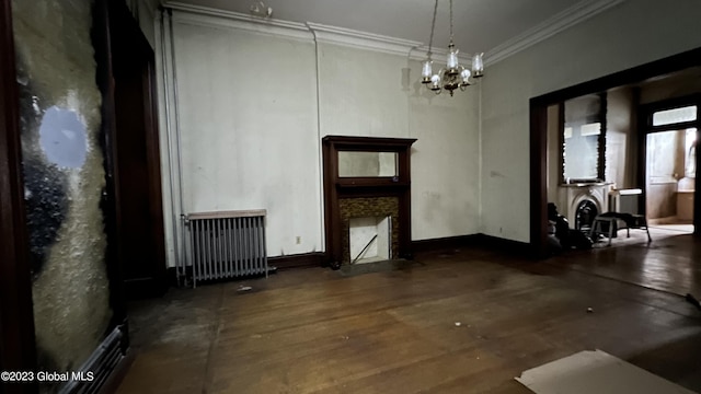 miscellaneous room with ornamental molding, dark hardwood / wood-style flooring, radiator, a notable chandelier, and a fireplace