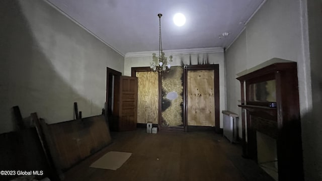 dining room with a notable chandelier and crown molding