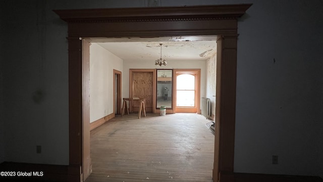 corridor with hardwood / wood-style floors