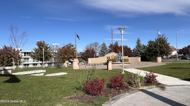 view of home's community featuring a yard