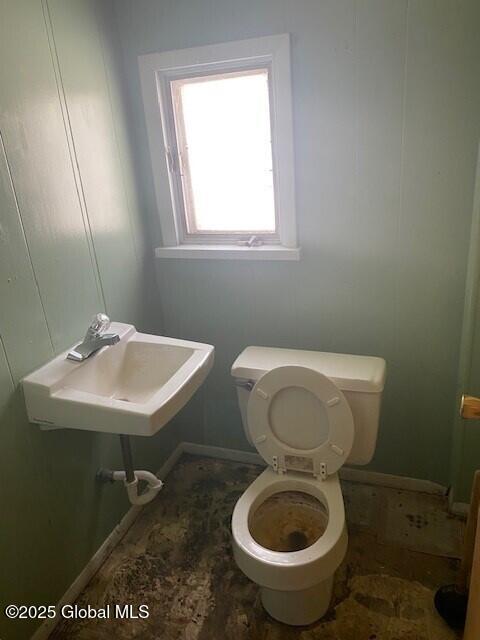 bathroom with toilet and sink