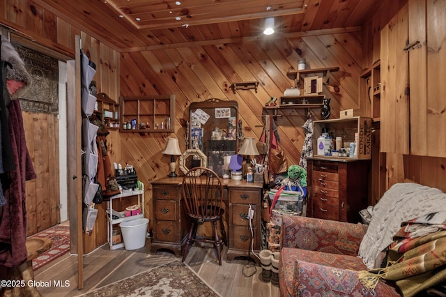 office area featuring wooden walls, wood ceiling, and wood finished floors