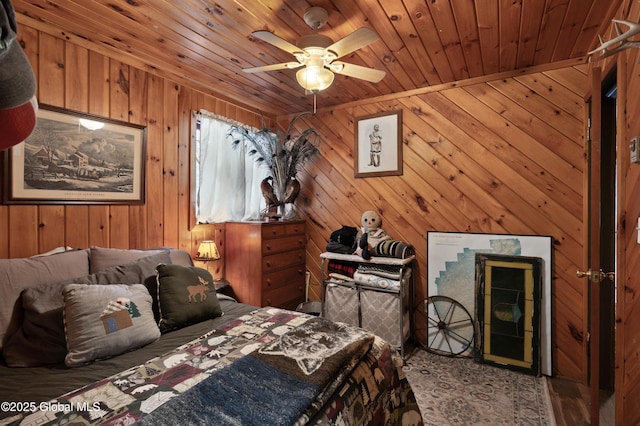bedroom with wooden walls and wood ceiling