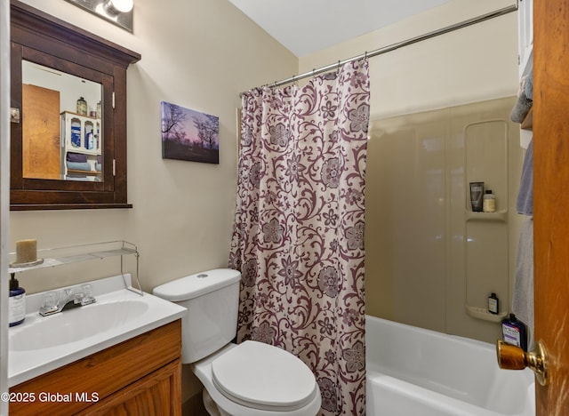 bathroom featuring toilet, shower / bathtub combination with curtain, and vanity
