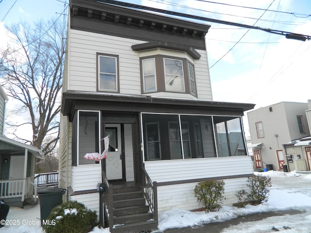 view of front facade featuring a sunroom