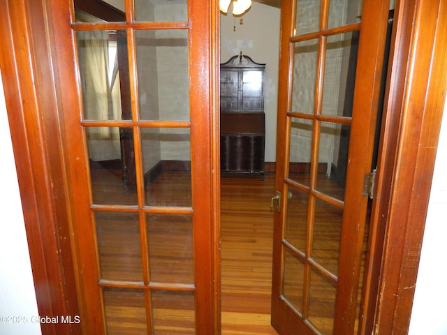 misc room featuring wood-type flooring and french doors