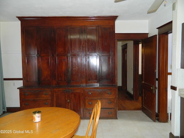 unfurnished dining area featuring ceiling fan