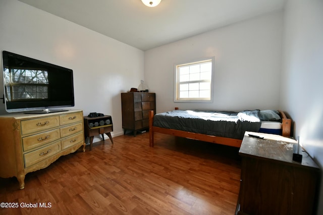 bedroom with wood finished floors