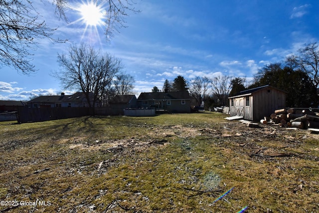 view of yard with an outbuilding and a storage unit