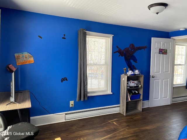 miscellaneous room with baseboards, a baseboard heating unit, and wood finished floors