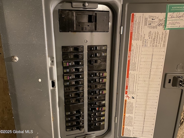 utility room featuring electric panel