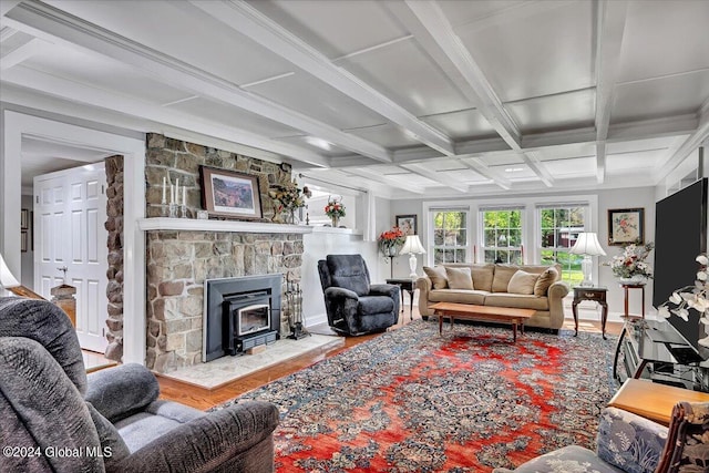 living room with coffered ceiling, light hardwood / wood-style floors, and beam ceiling