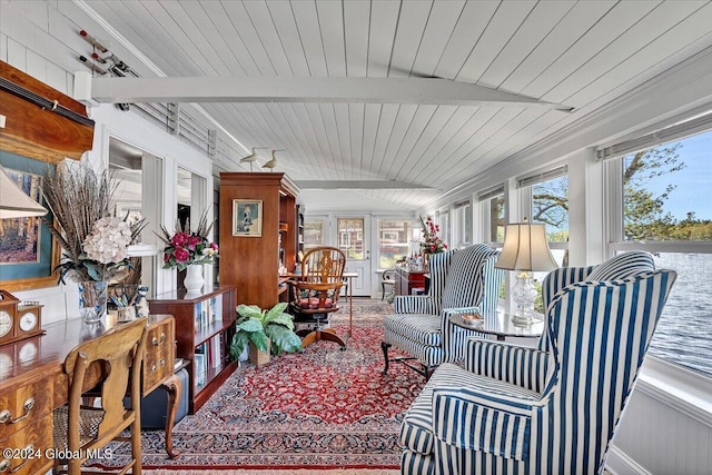 sunroom / solarium with a water view, a wealth of natural light, and wood ceiling