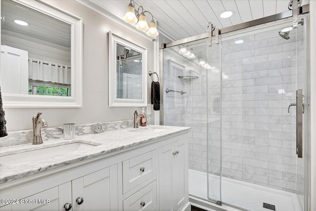 bathroom with vanity and an enclosed shower