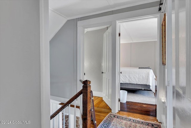 corridor featuring hardwood / wood-style floors