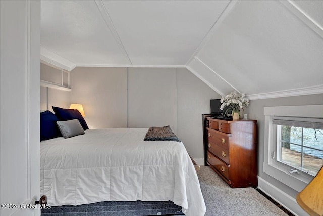 carpeted bedroom featuring vaulted ceiling