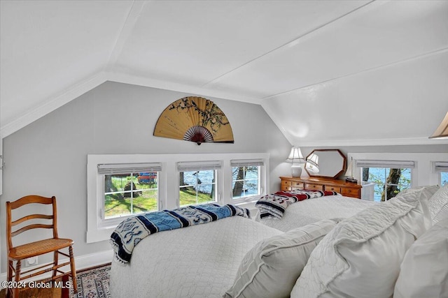 bedroom featuring lofted ceiling and hardwood / wood-style flooring