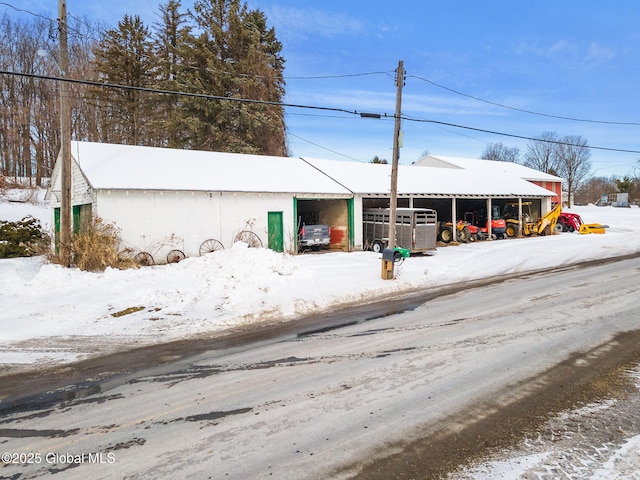 exterior space with a pole building and an outdoor structure