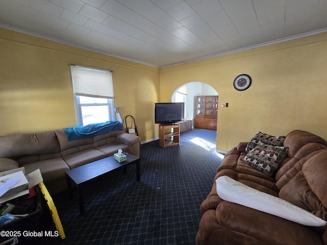 living room featuring crown molding and carpet flooring