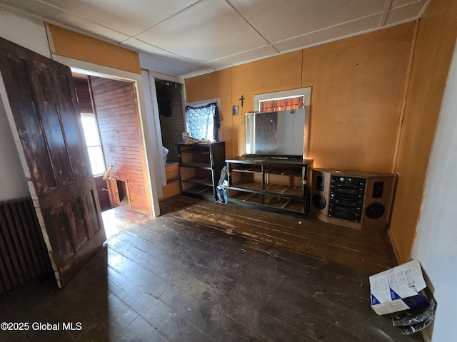 foyer with dark hardwood / wood-style flooring and radiator