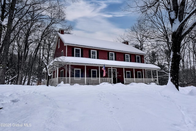 view of front of property featuring a porch and a chimney