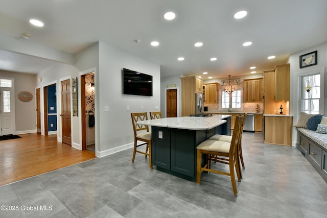 dining space with baseboards and recessed lighting