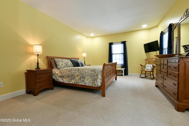 bedroom with light carpet, recessed lighting, and baseboards