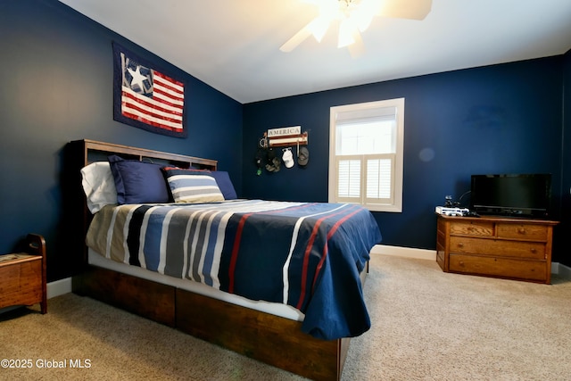 bedroom with carpet, baseboards, and a ceiling fan