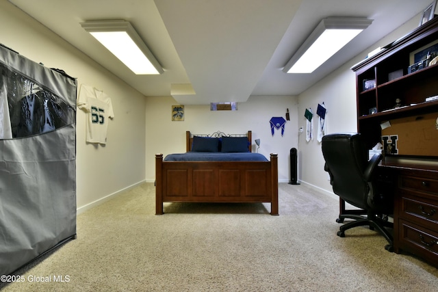 bedroom featuring carpet and baseboards