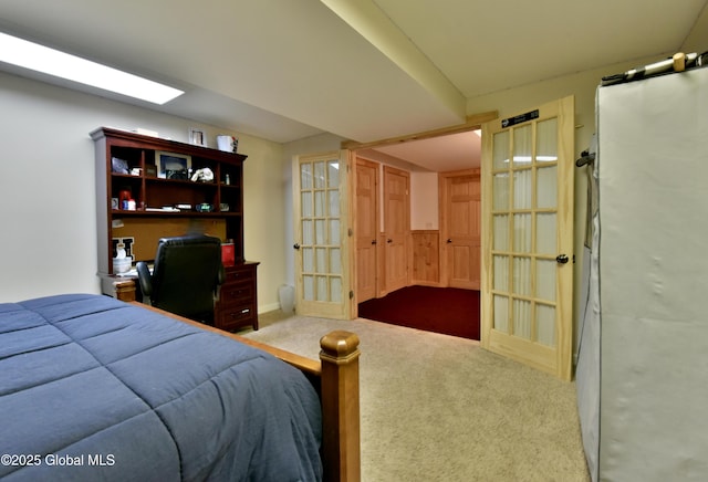 bedroom with french doors and carpet