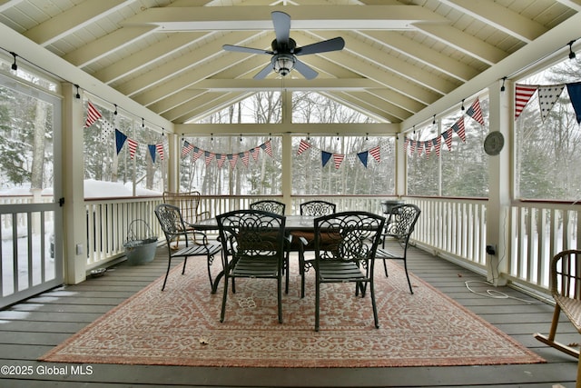 sunroom featuring a ceiling fan, wooden ceiling, and lofted ceiling with beams