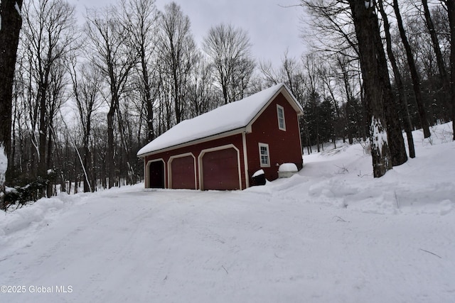 view of snow covered garage