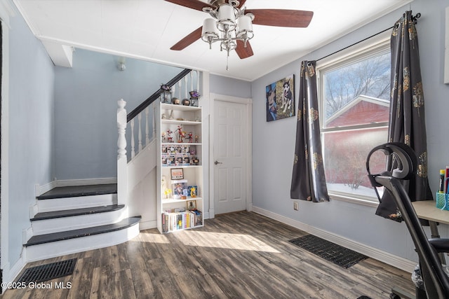 interior space with ceiling fan and hardwood / wood-style floors