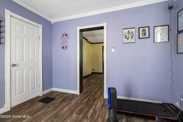 interior space with crown molding and dark hardwood / wood-style floors