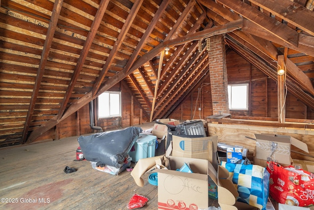 attic featuring a wealth of natural light