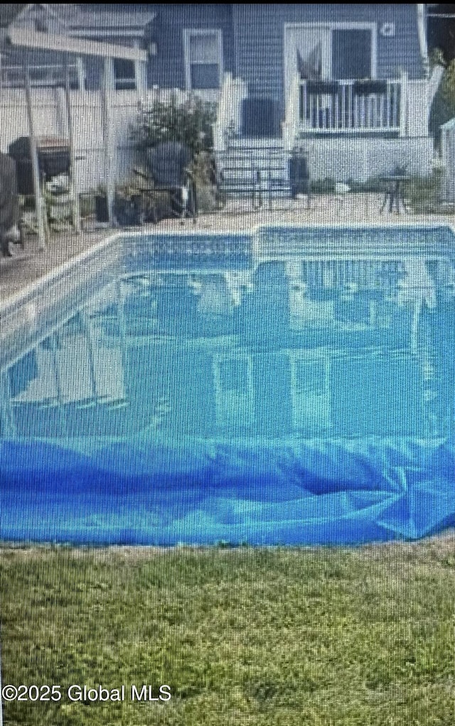 view of pool with central air condition unit