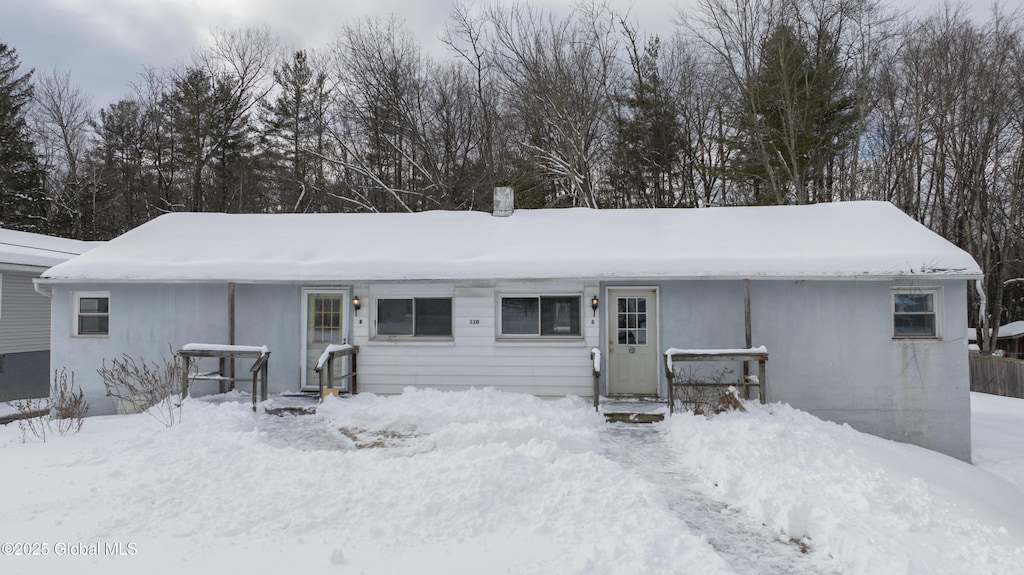 view of snow covered house