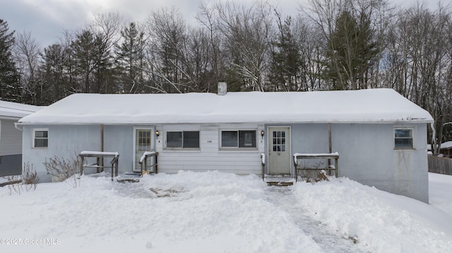 view of snow covered house