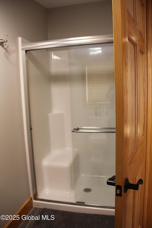 bathroom featuring an enclosed shower