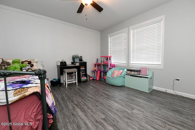 bedroom with ceiling fan and dark hardwood / wood-style floors